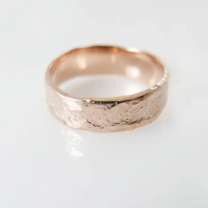 14k Rose gold 5.5 mm wide textured wedding band